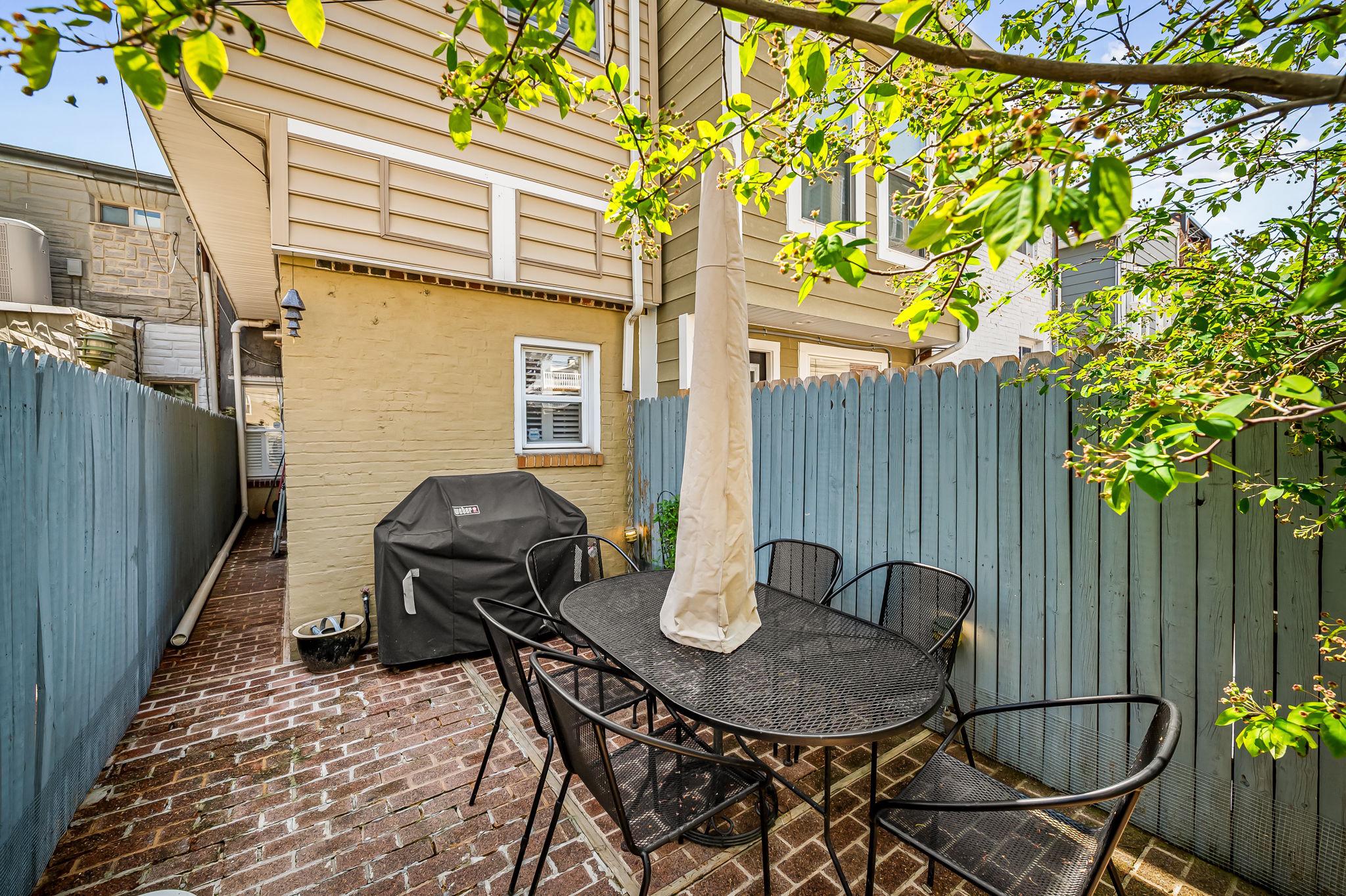 3134 Elliott Street Baltimore, MD 21224 - Photo 29 of 34 a backyard of a house with table and chairs
