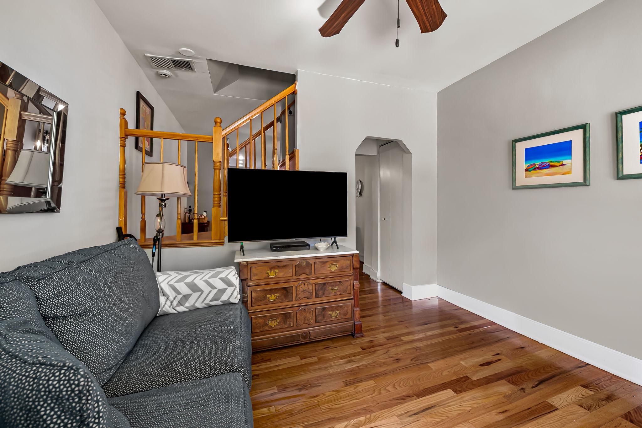 3134 Elliott Street Baltimore, MD 21224 - Photo 6 of 34 a living room with furniture and a flat screen tv