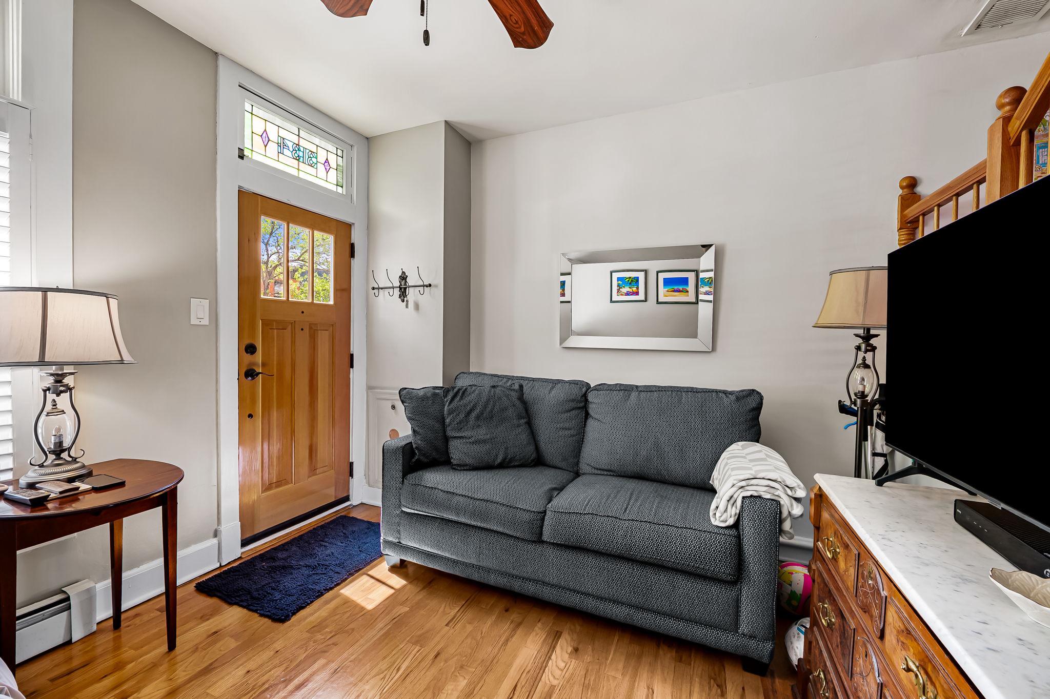 3134 Elliott Street Baltimore, MD 21224 - Photo 7 of 34 a living room with furniture and a flat screen tv