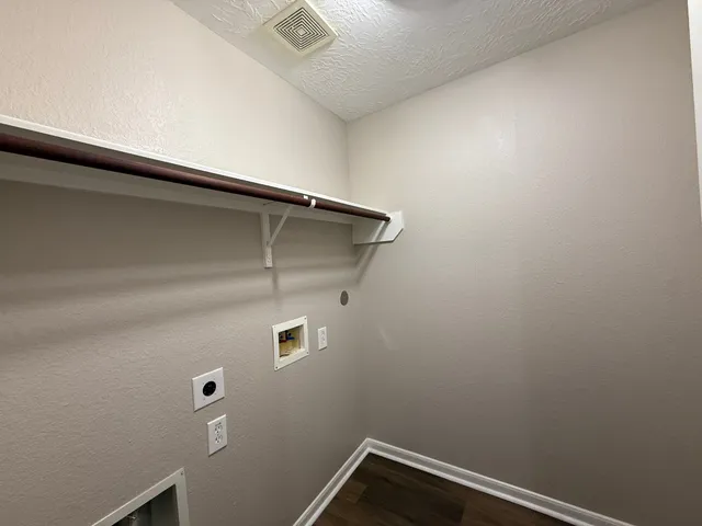 a view of small space with empty racks on the wall