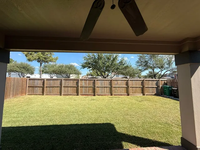 a large swimming pool with lawn chairs