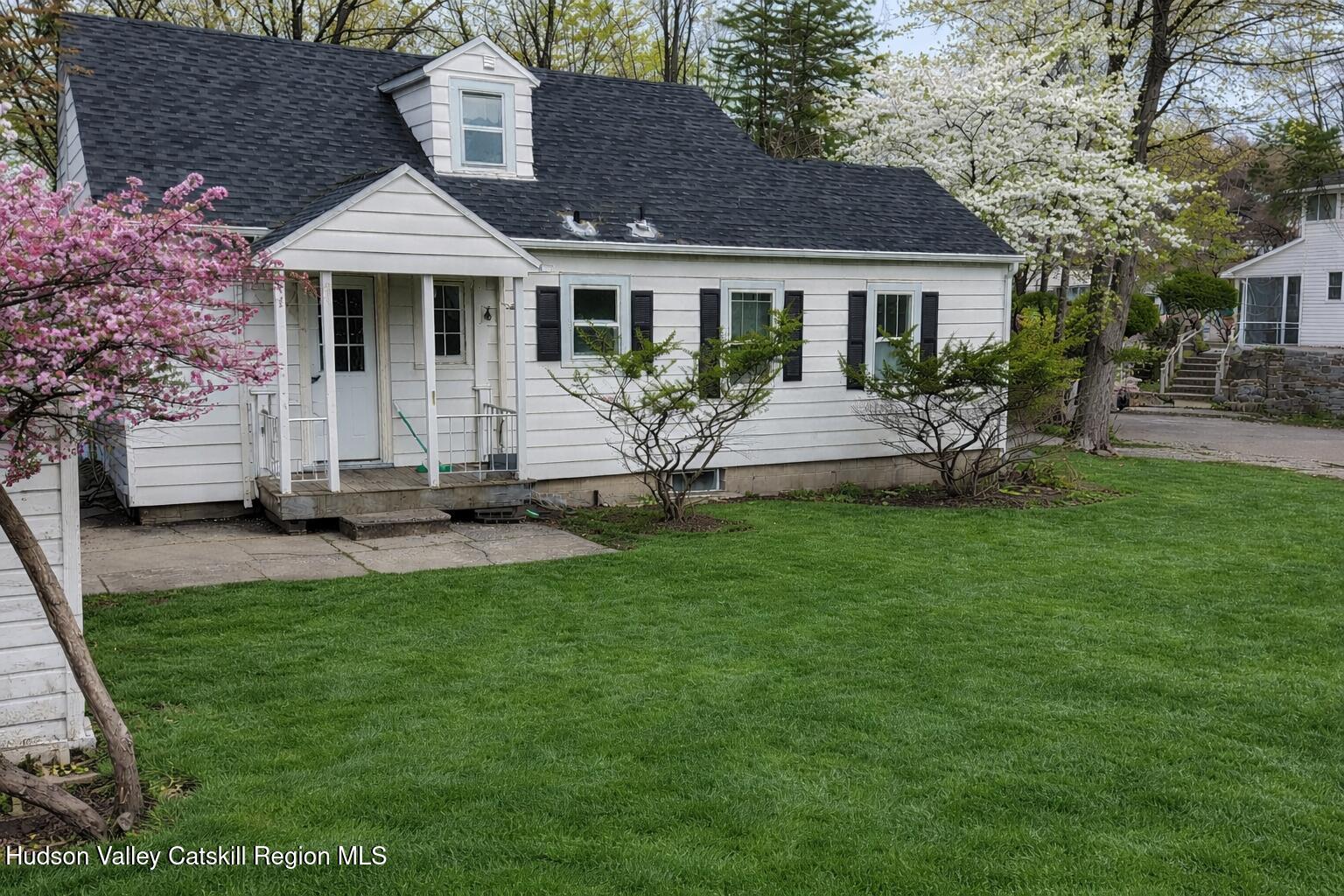 222 Zandhoek Road Hurley, NY 12443 - Photo 19 of 23 a front view of a house with a garden and fire pit