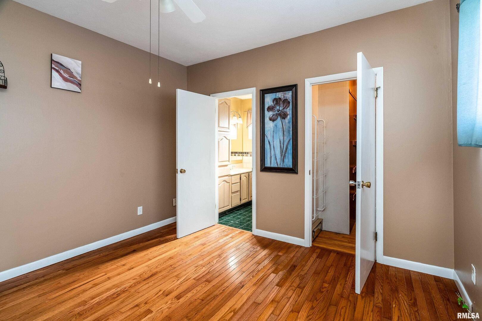 311 Baggott Street Zeigler, IL 62999 - Photo 19 of 38 a view of an empty room with wooden floor and a window