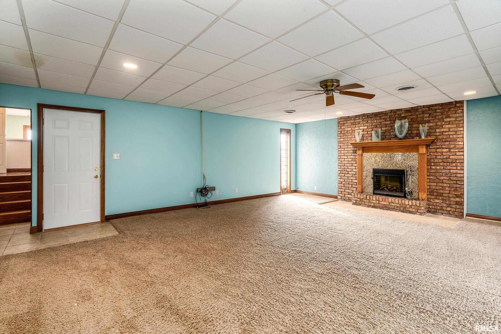 311 Baggott Street Zeigler, IL 62999 - Photo 24 of 38 a view of empty room with fireplace and fan