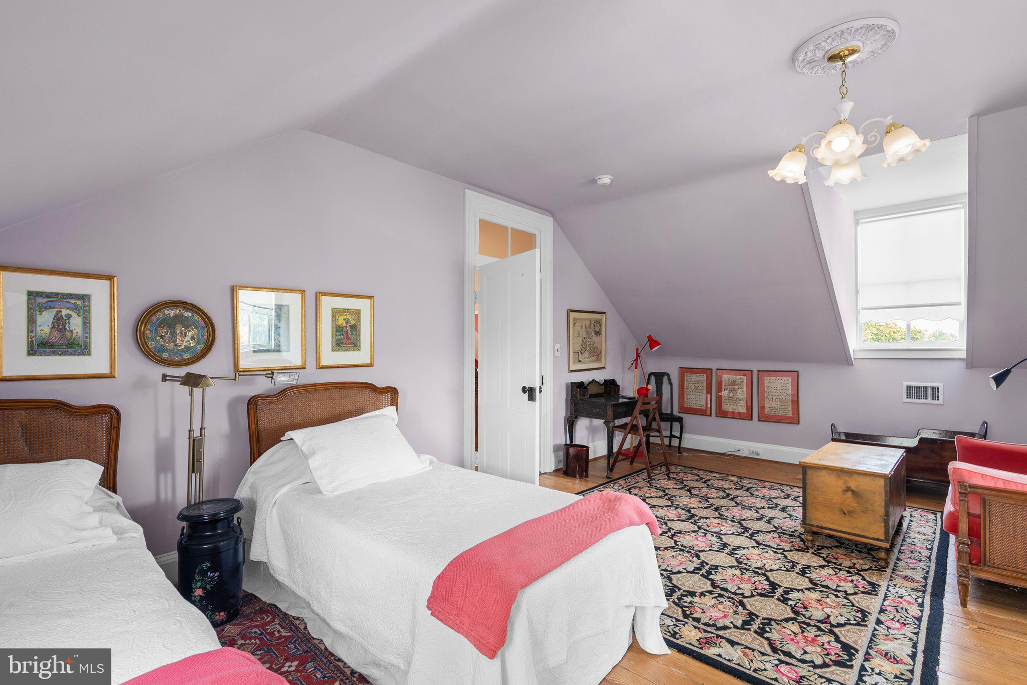 15407 Dr Bowen Road Aquasco, MD 20608 - Photo 45 of 89 a bedroom with a bed a chandelier and mirror