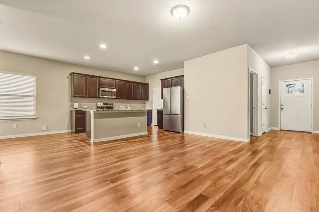 a view of a house with a backyard