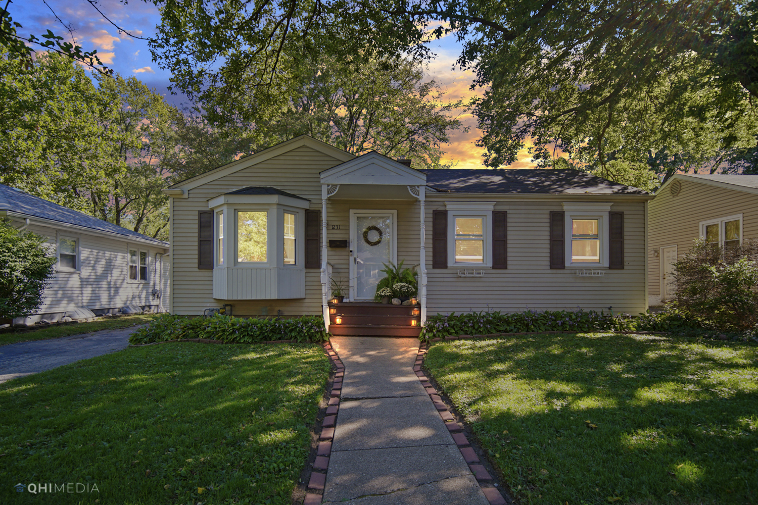 1231 Olive Road Homewood, IL 60430 - Photo 2 of 23 a front view of a house with a garden