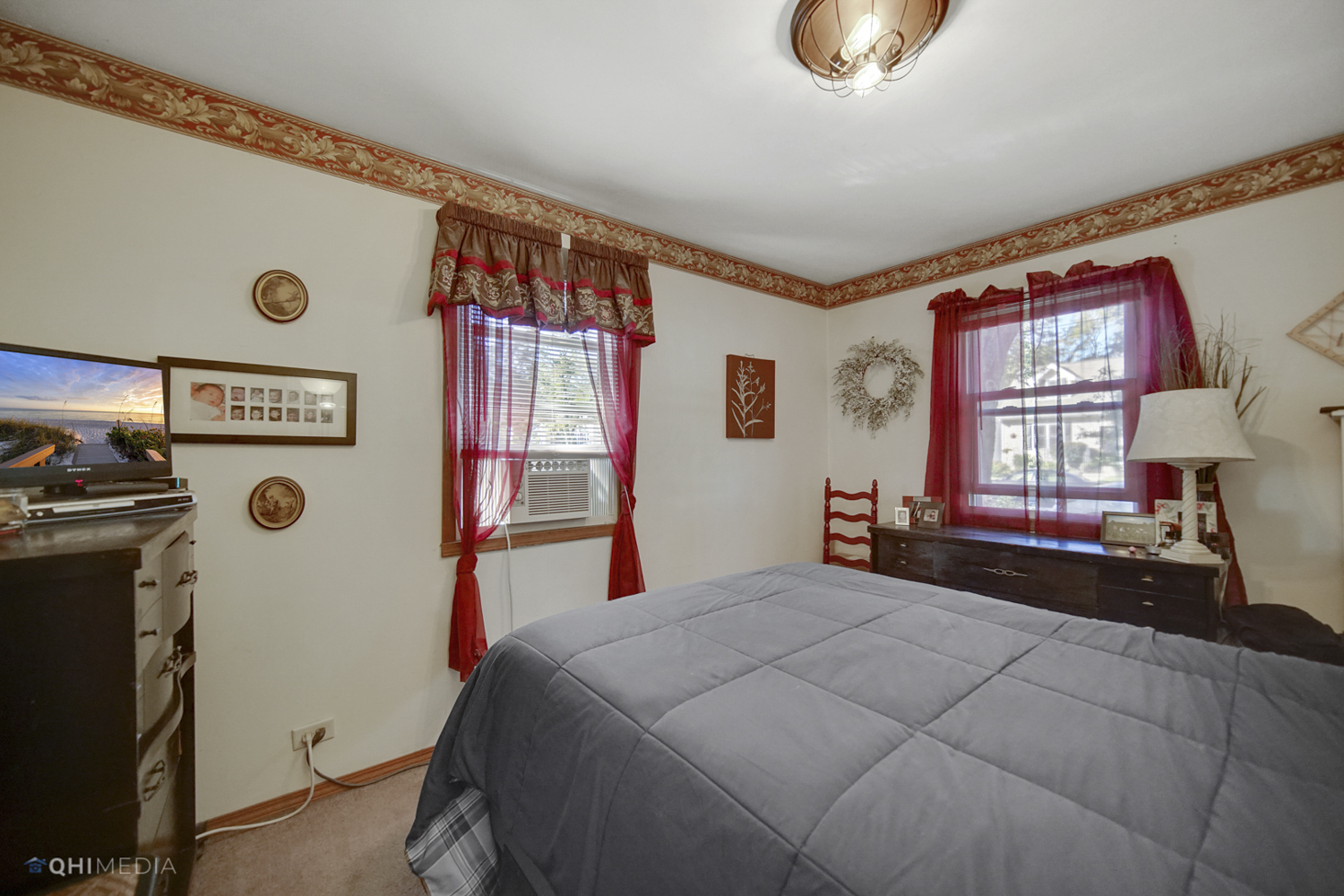 1231 Olive Road Homewood, IL 60430 - Photo 12 of 23 a bedroom with a bed and a dresser next to a window