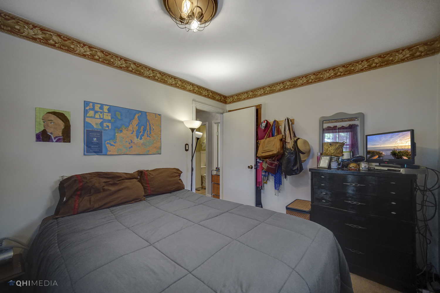 1231 Olive Road Homewood, IL 60430 - Photo 13 of 23 a bed room with a bed and a television
