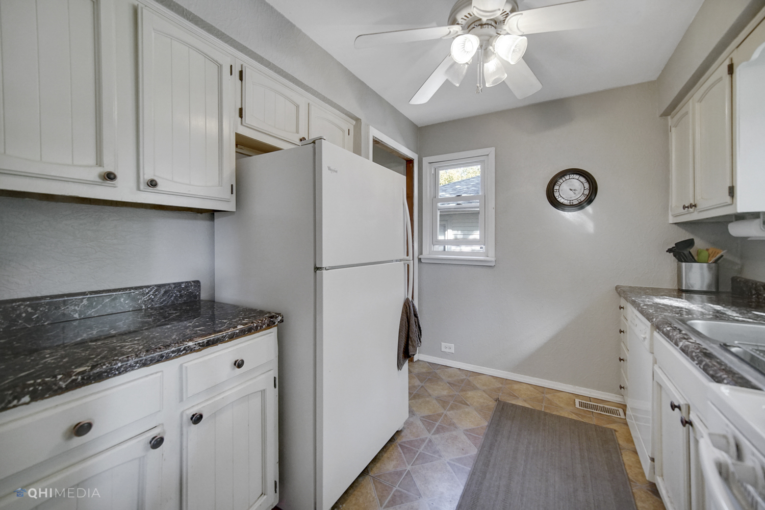 1231 Olive Road Homewood, IL 60430 - Photo 8 of 23 a kitchen with granite countertop a refrigerator a stove a sink and dishwasher with wooden floor