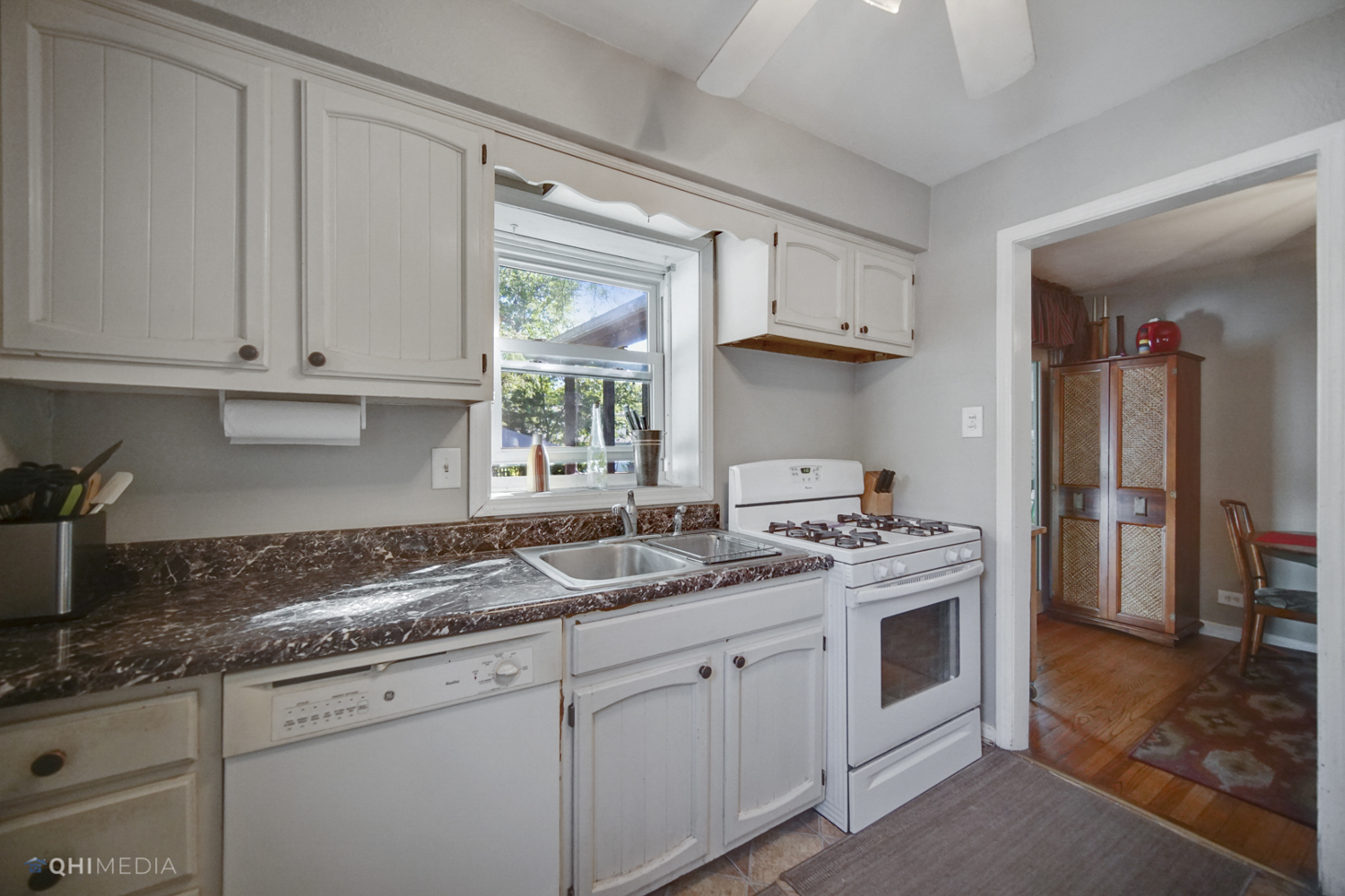 1231 Olive Road Homewood, IL 60430 - Photo 9 of 23 a kitchen with stainless steel appliances granite countertop a sink stove and cabinets