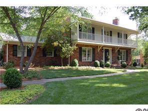 3101 Ferncliff Road Charlotte, NC 28211 - Photo 2 of 16 a front view of a house with a yard table and chairs