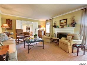 3101 Ferncliff Road Charlotte, NC 28211 - Photo 4 of 16 a living room with furniture a fireplace and a table
