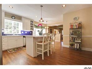3101 Ferncliff Road Charlotte, NC 28211 - Photo 6 of 16 a room with stainless steel appliances kitchen island granite countertop a table chairs and a cabinets