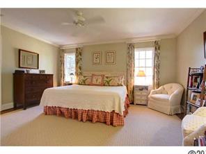 3101 Ferncliff Road Charlotte, NC 28211 - Photo 10 of 16 a bedroom with a bed couch and windows