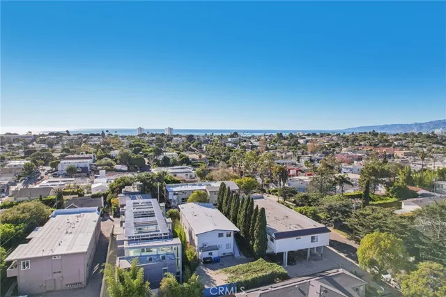 an aerial view of residential houses and city street