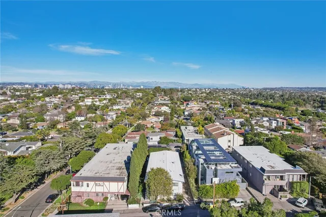 an aerial view of residential houses and city street