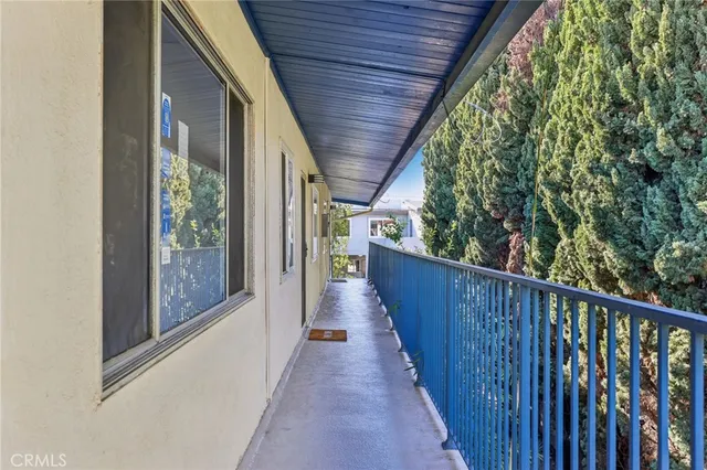 a view of a porch with wooden floor
