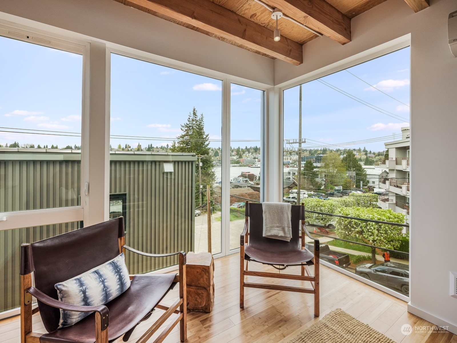 117 East Allison Street Seattle, WA 98102 - Photo 13 of 38 a living room with furniture and a floor to ceiling window