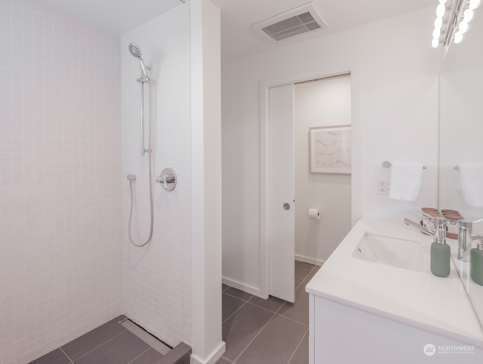 117 East Allison Street Seattle, WA 98102 - Photo 21 of 38 a bathroom with a sink and shower