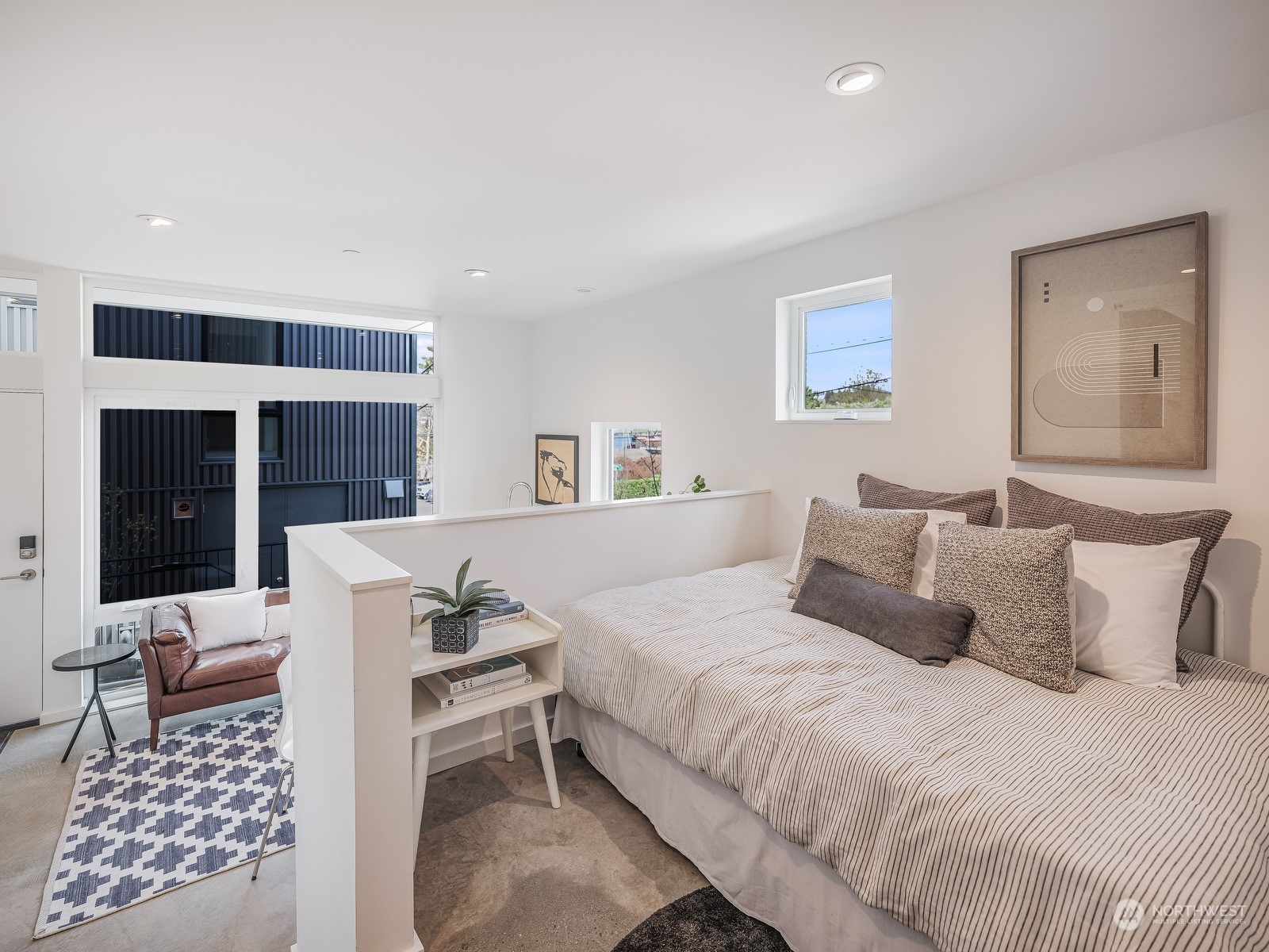 117 East Allison Street Seattle, WA 98102 - Photo 24 of 38 a bedroom with a bed and a couch