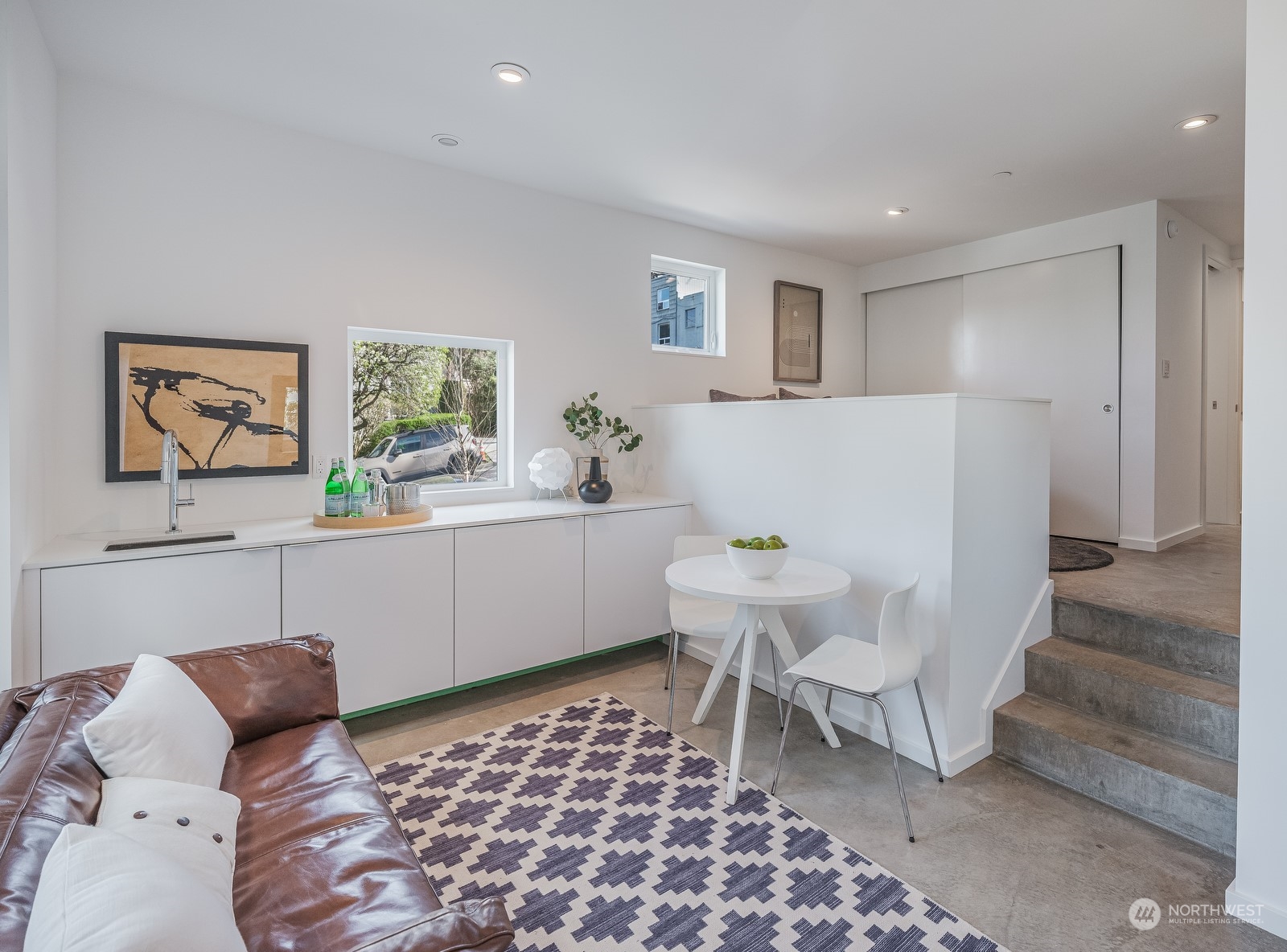 117 East Allison Street Seattle, WA 98102 - Photo 29 of 38 a living room with a couch and a rug