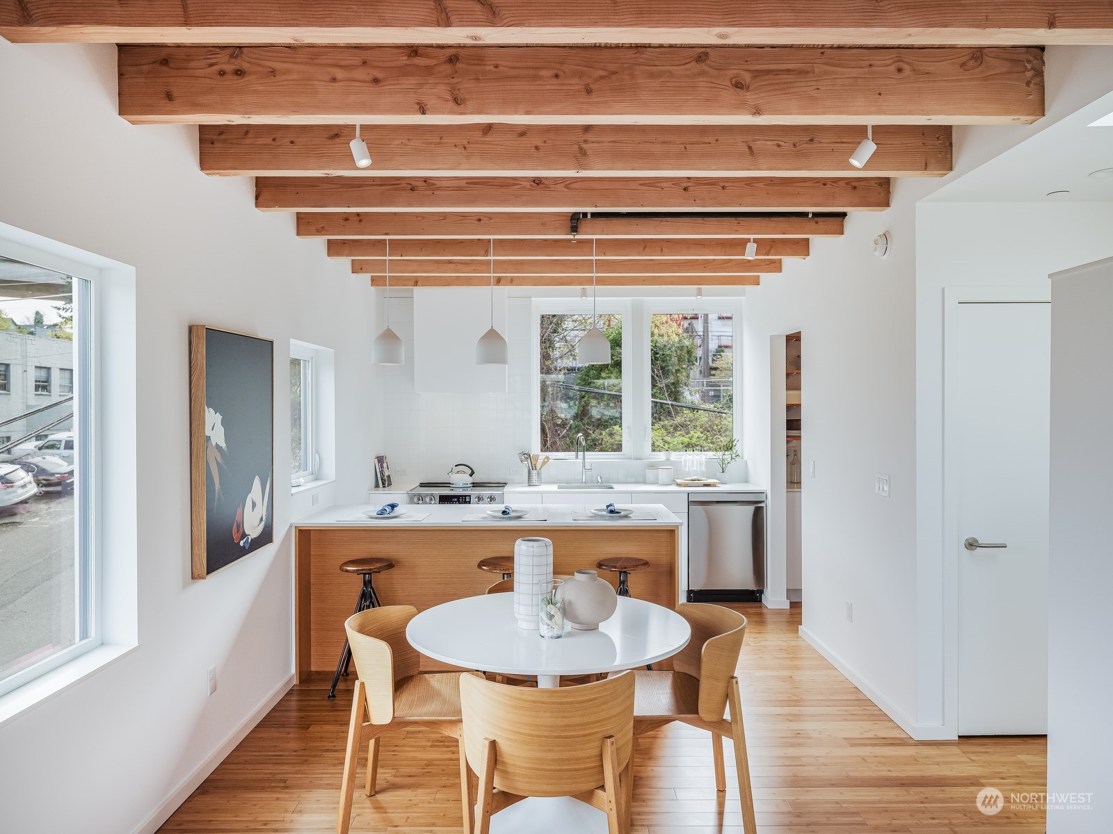 117 East Allison Street Seattle, WA 98102 - Photo 4 of 38 a dining table with chairs and wooden floor