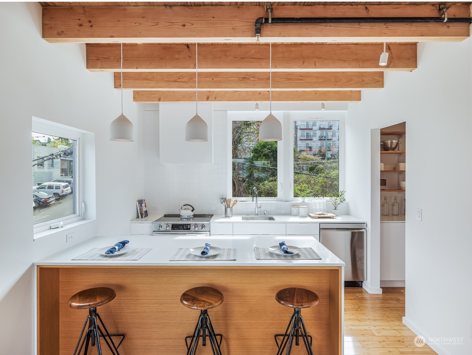 117 East Allison Street Seattle, WA 98102 - Photo 5 of 38 a room with a table and a stove