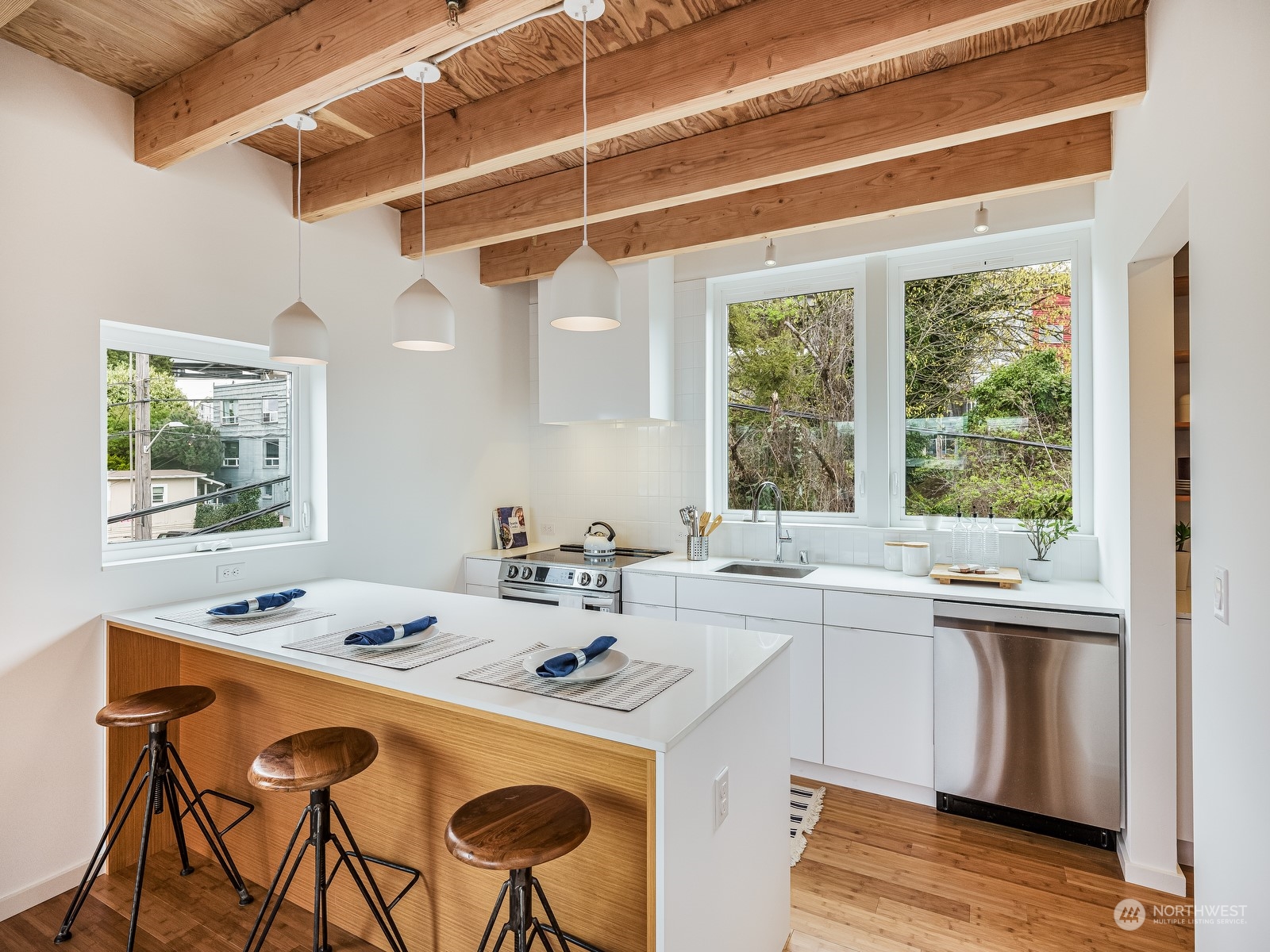 117 East Allison Street Seattle, WA 98102 - Photo 6 of 38 a dining room with a table chairs and wooden floor