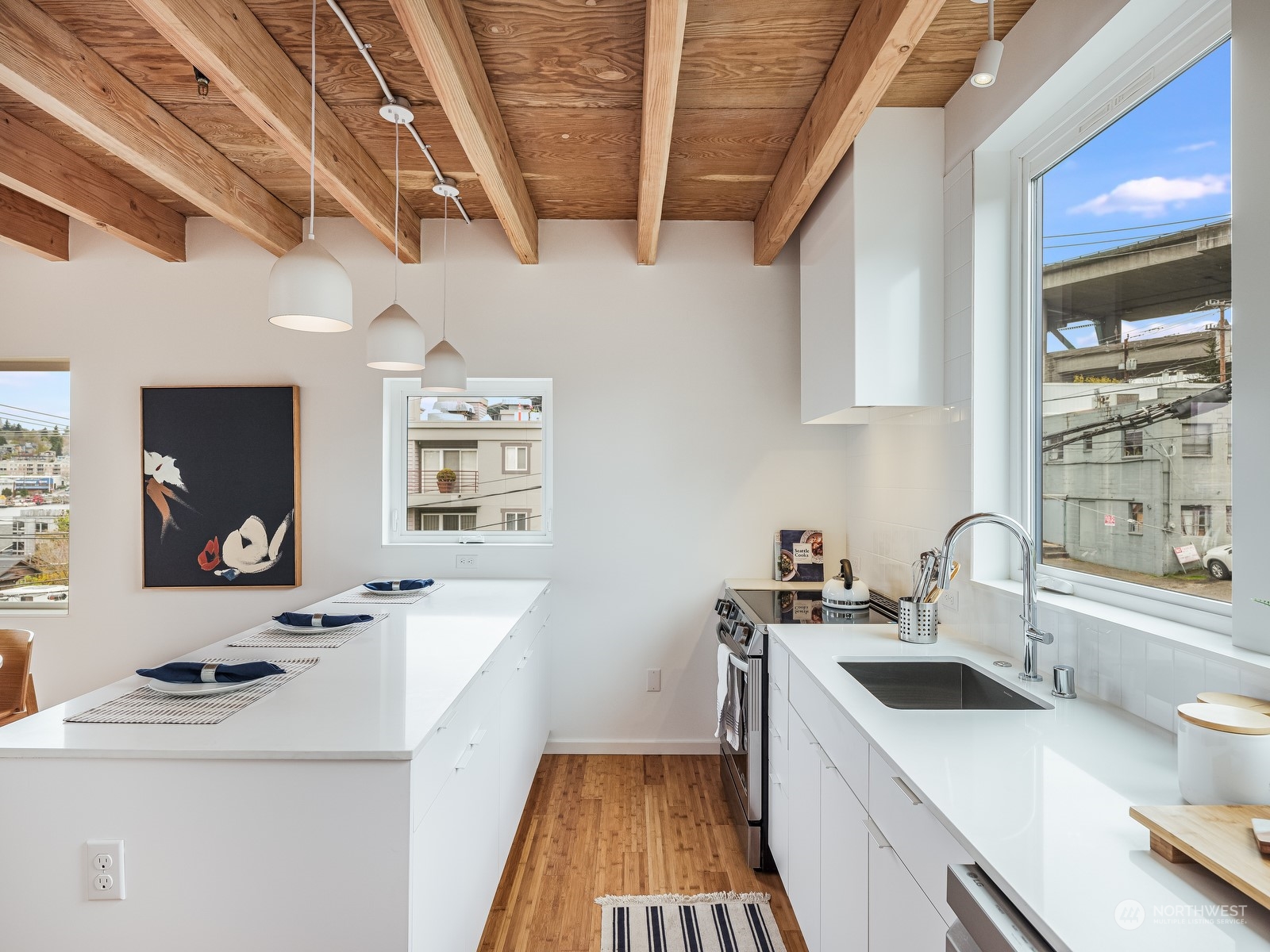 117 East Allison Street Seattle, WA 98102 - Photo 7 of 38 a kitchen with a sink a stove and cabinets