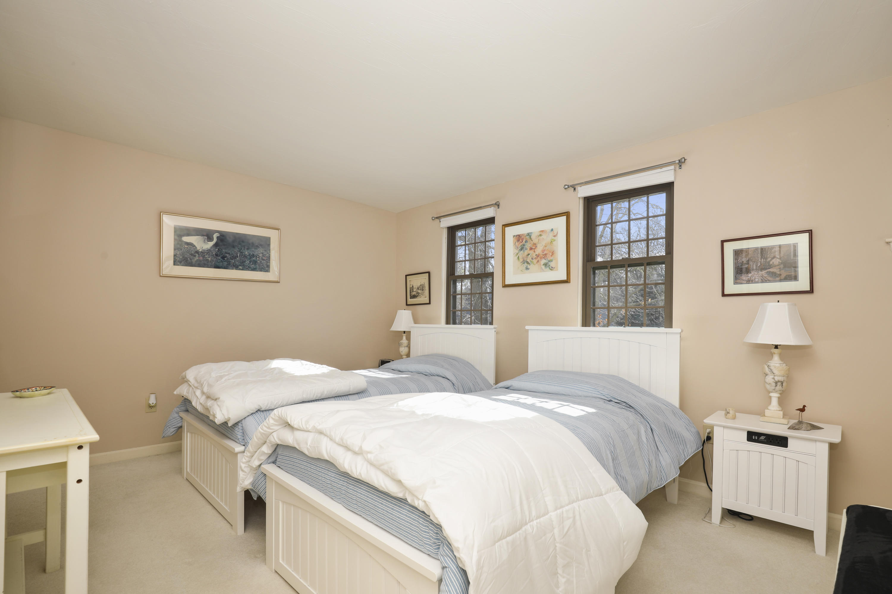 33 West Road, Unit 7B Orleans, MA 02653 - Photo 11 of 24 a bedroom with a bed and a lamp