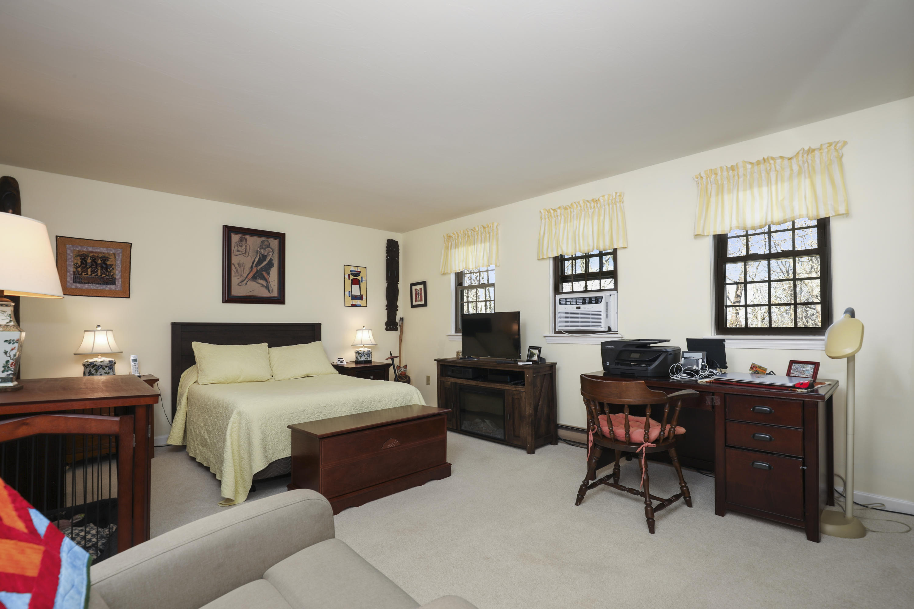 33 West Road, Unit 7B Orleans, MA 02653 - Photo 13 of 24 a bedroom with a bed work place and a desk