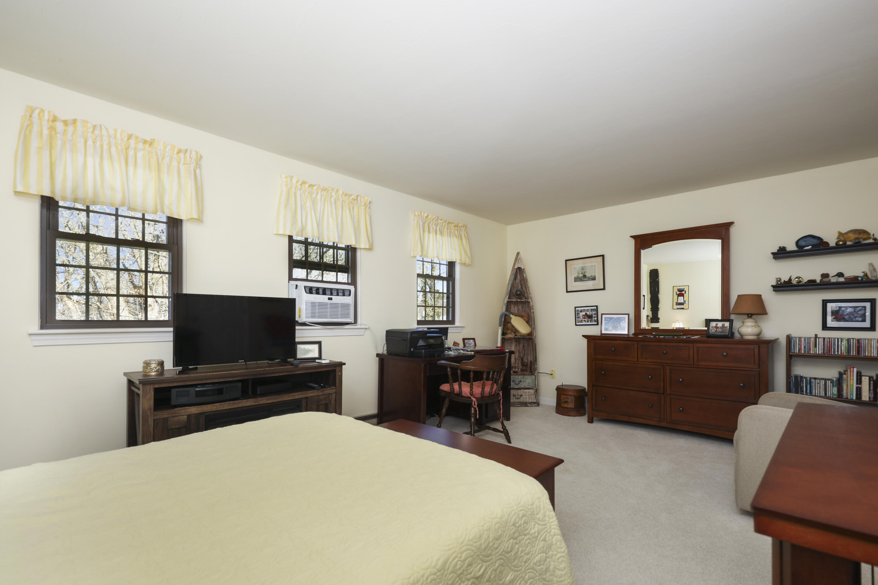 33 West Road, Unit 7B Orleans, MA 02653 - Photo 14 of 24 a living room with furniture and a flat screen tv
