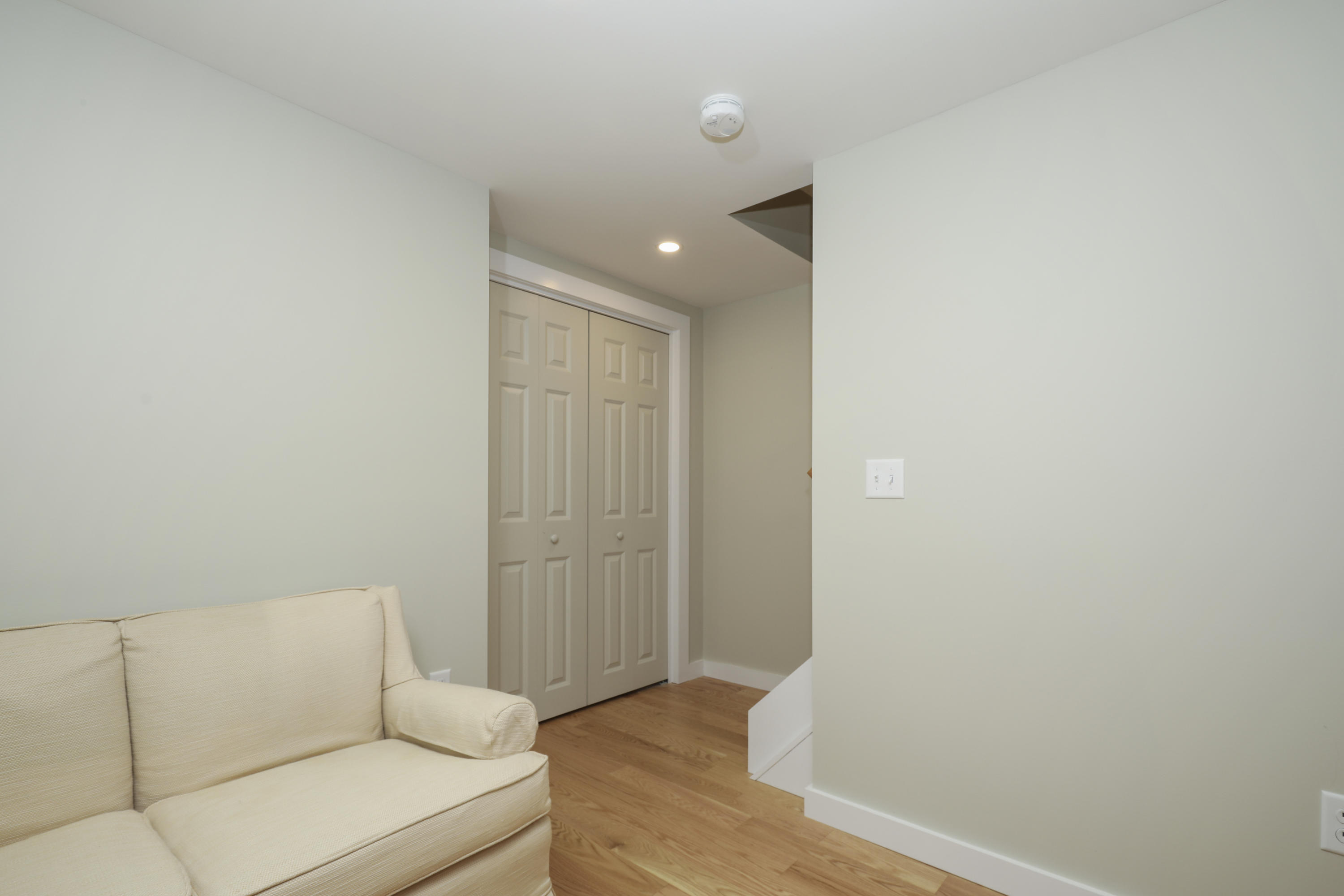 33 West Road, Unit 7B Orleans, MA 02653 - Photo 17 of 24 a living room with furniture and wooden floor
