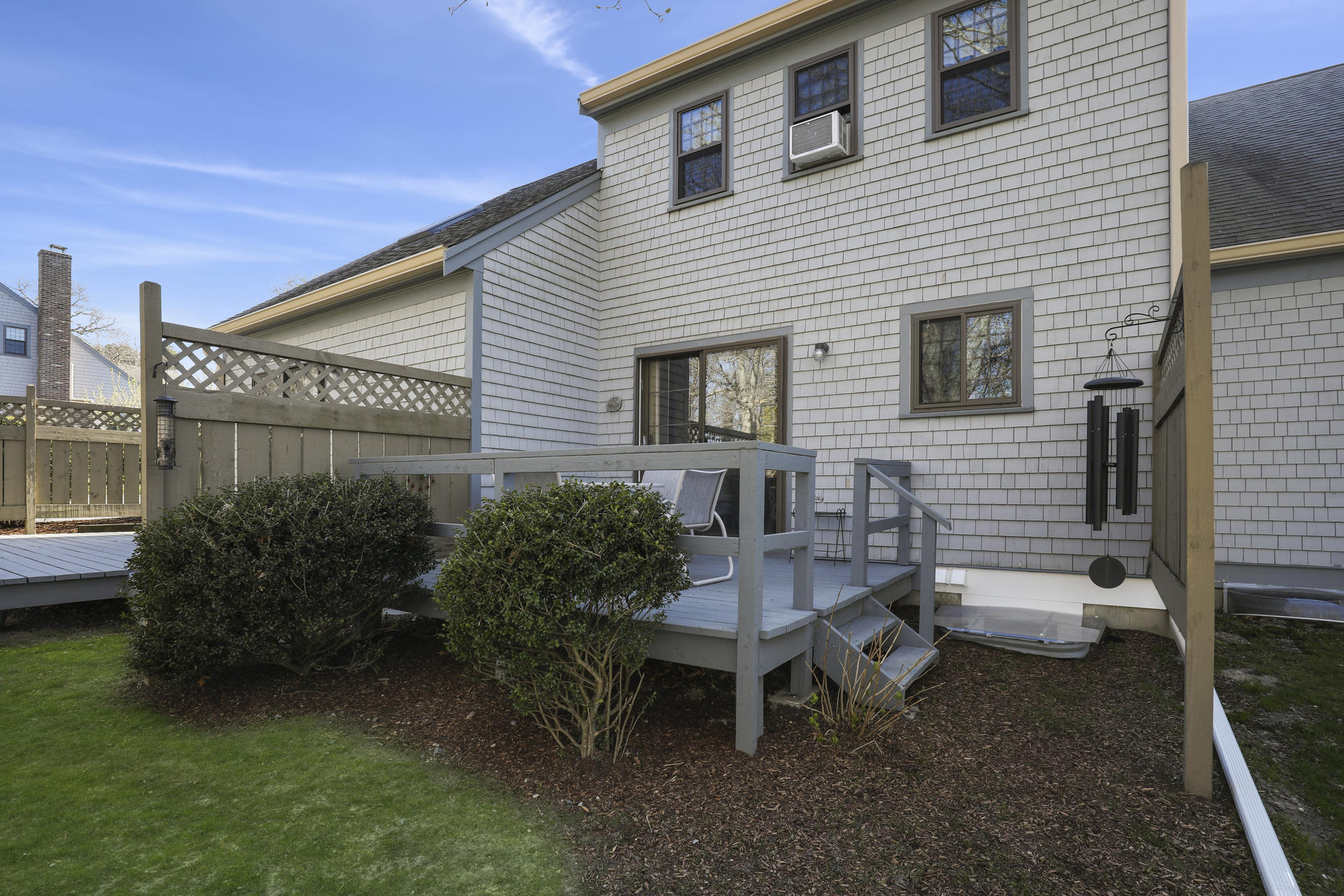 33 West Road, Unit 7B Orleans, MA 02653 - Photo 22 of 24 a view of a house with backyard and sitting area