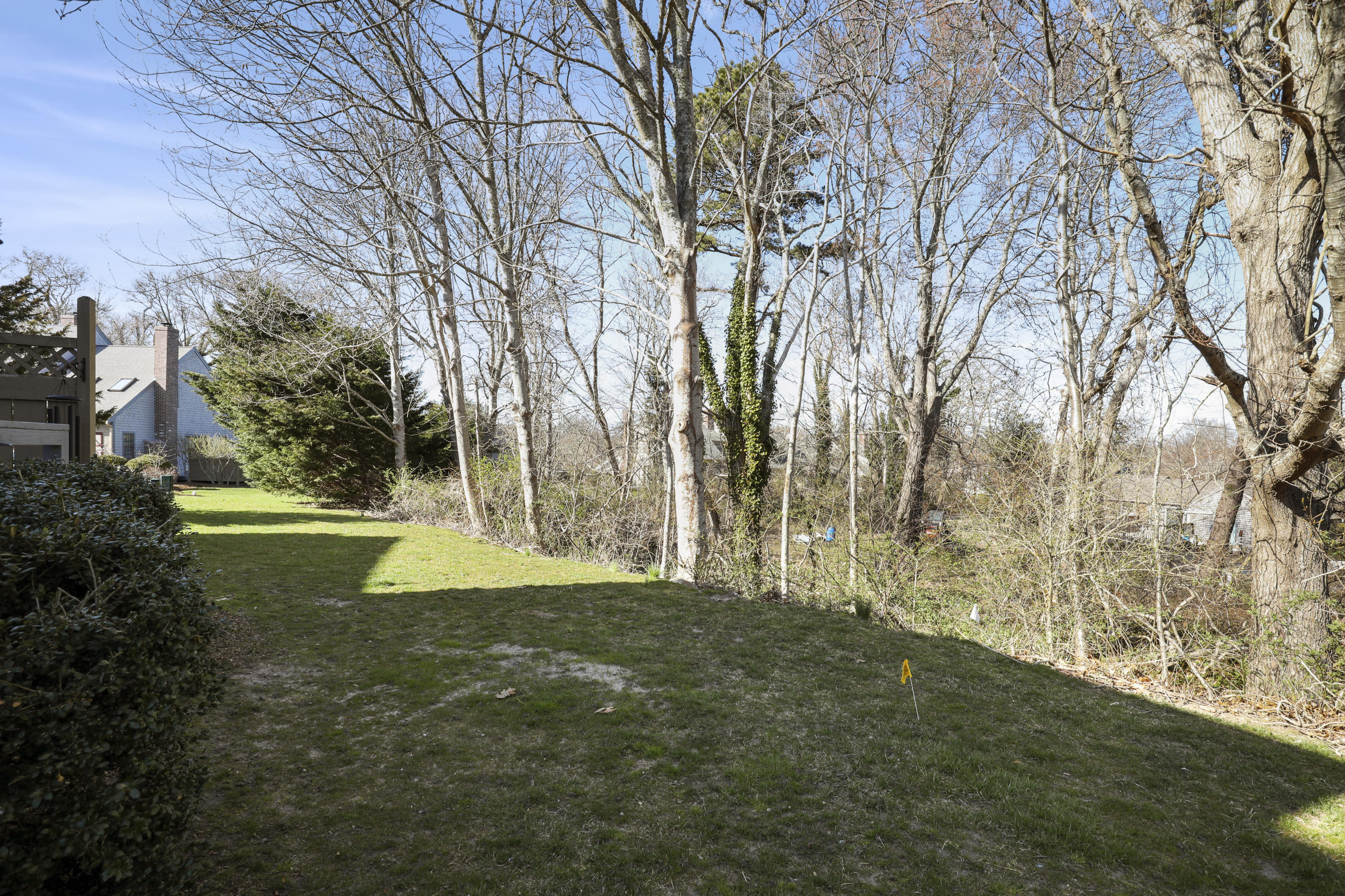33 West Road, Unit 7B Orleans, MA 02653 - Photo 23 of 24 a view of a house with a yard