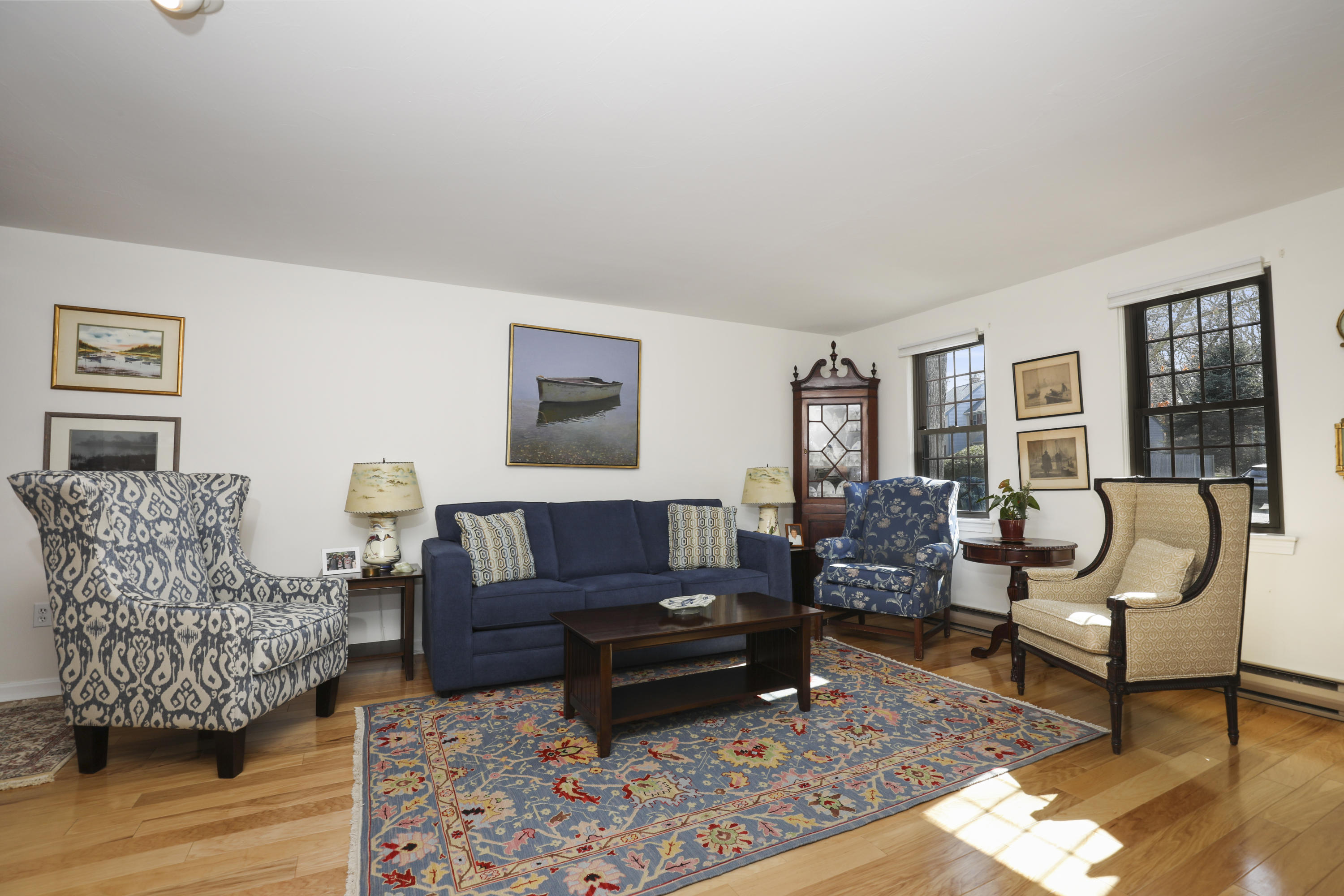 33 West Road, Unit 7B Orleans, MA 02653 - Photo 5 of 24 a living room with furniture and a rug
