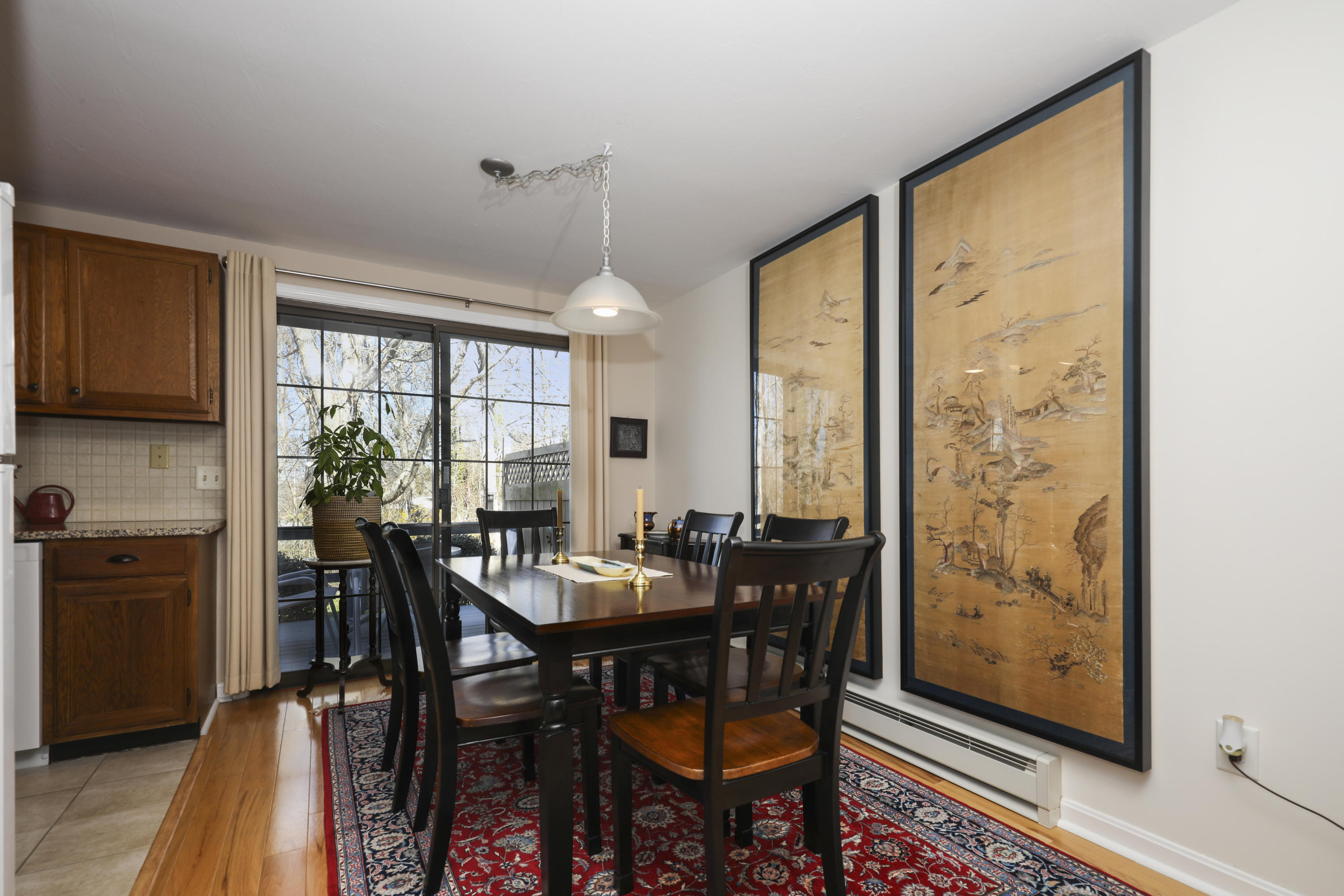 33 West Road, Unit 7B Orleans, MA 02653 - Photo 7 of 24 a view of a dining room with furniture window and wooden floor
