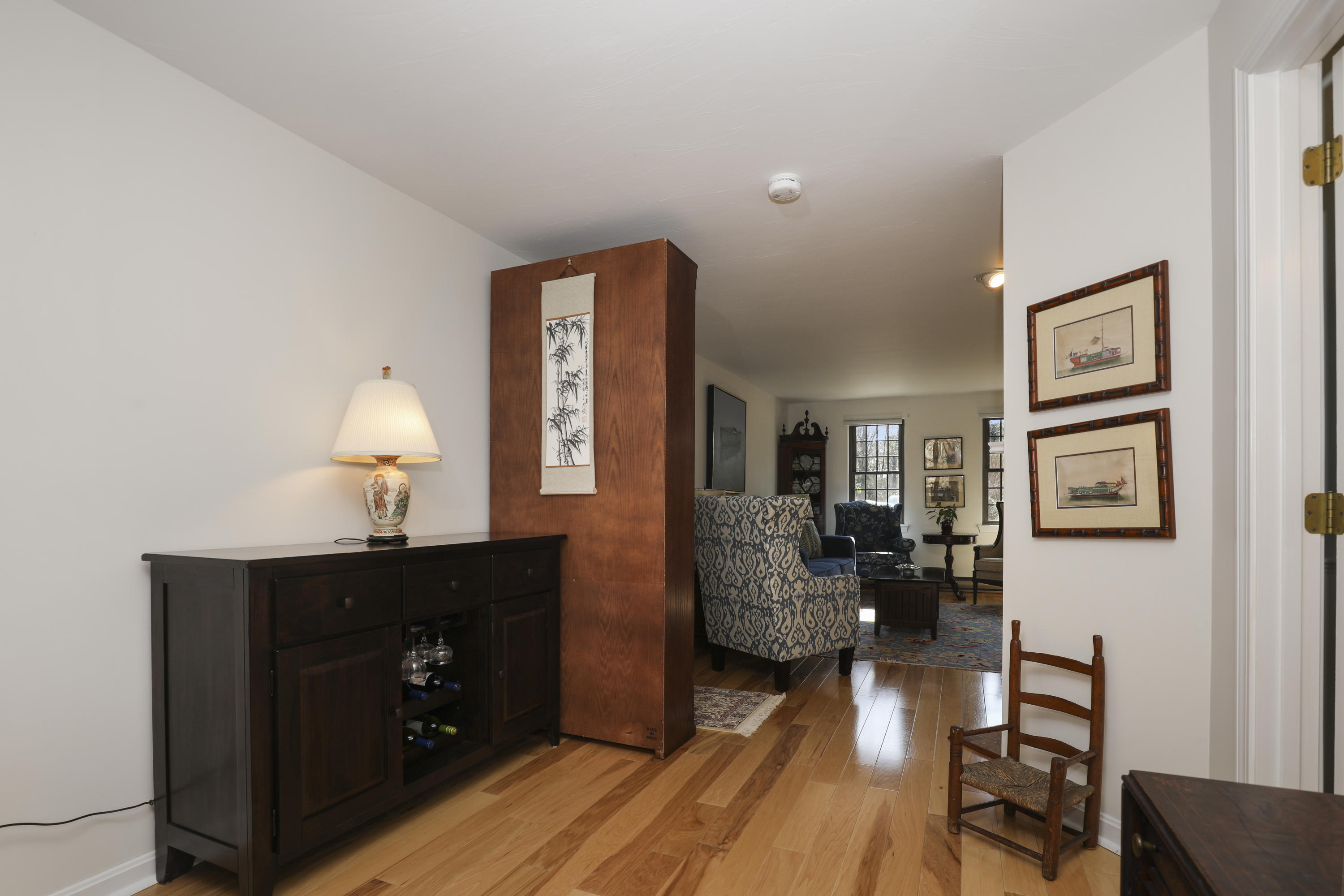 33 West Road, Unit 7B Orleans, MA 02653 - Photo 8 of 24 a living room with furniture and a wooden floor