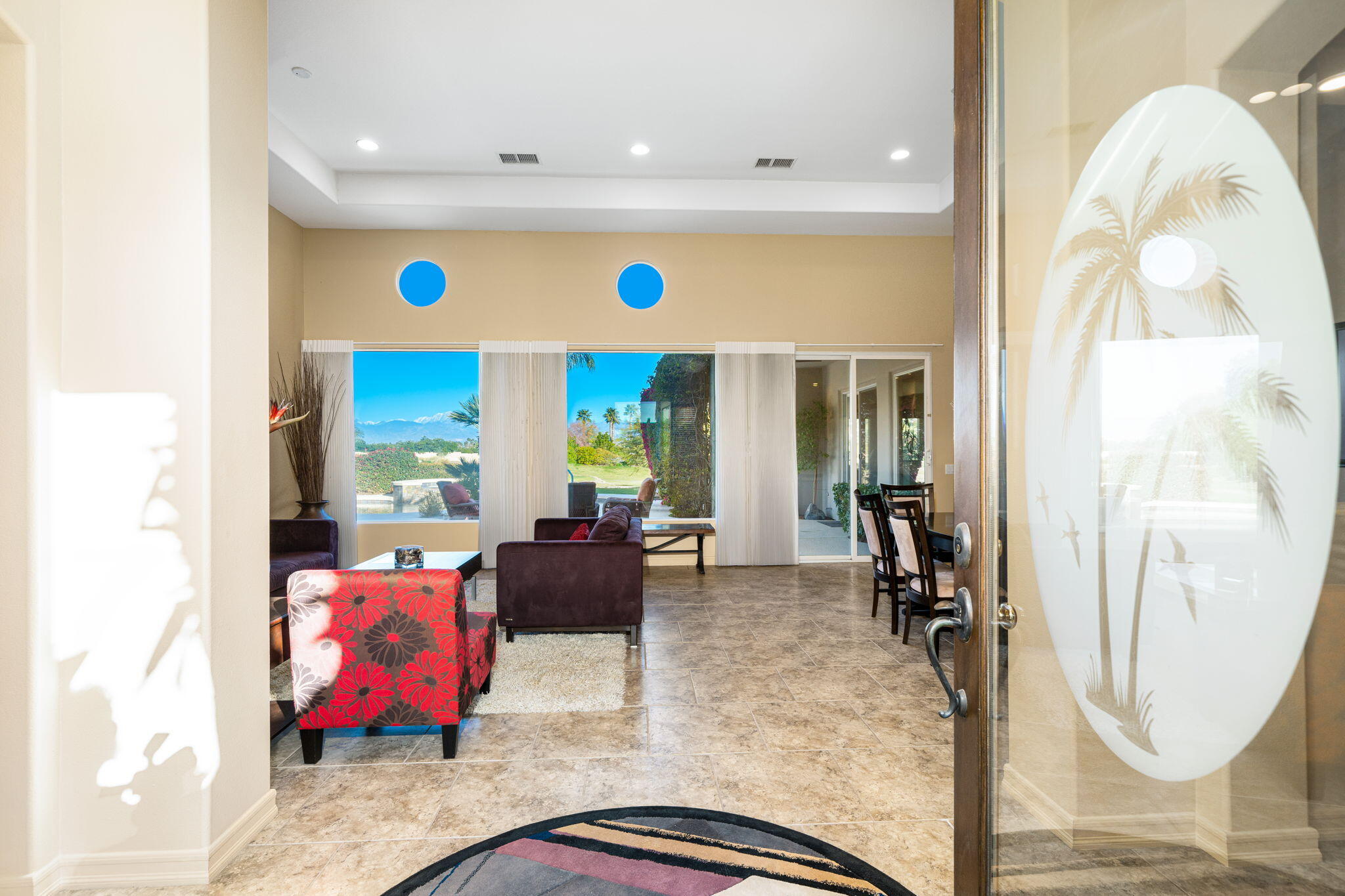 325 Loch Lomond Road Rancho Mirage, CA 92270 - Photo 13 of 49 a view of living room with furniture and floor to ceiling window