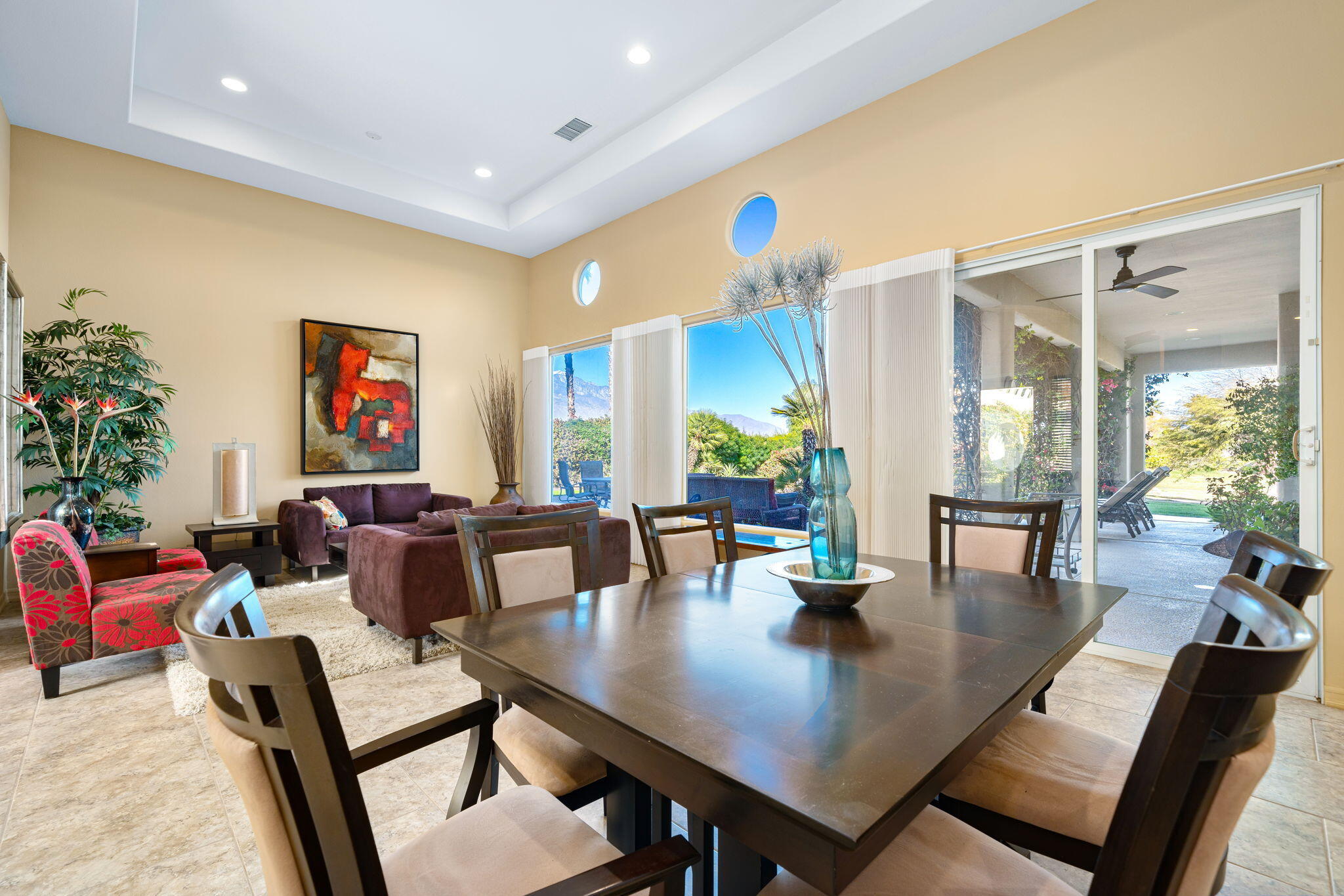 325 Loch Lomond Road Rancho Mirage, CA 92270 - Photo 16 of 49 a view of a dining room with furniture and wooden floor