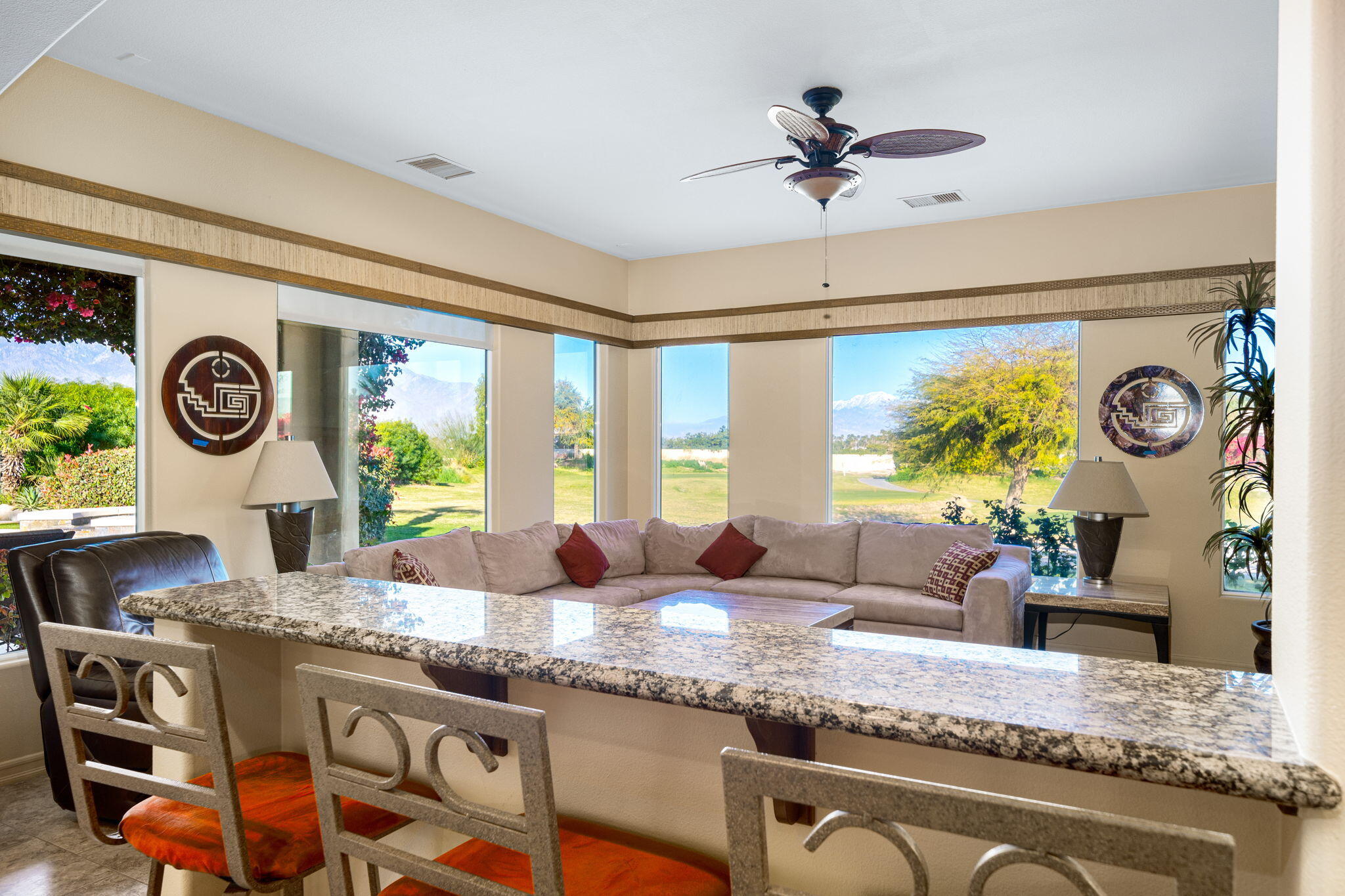 325 Loch Lomond Road Rancho Mirage, CA 92270 - Photo 23 of 49 a living room with granite countertop furniture and a clock