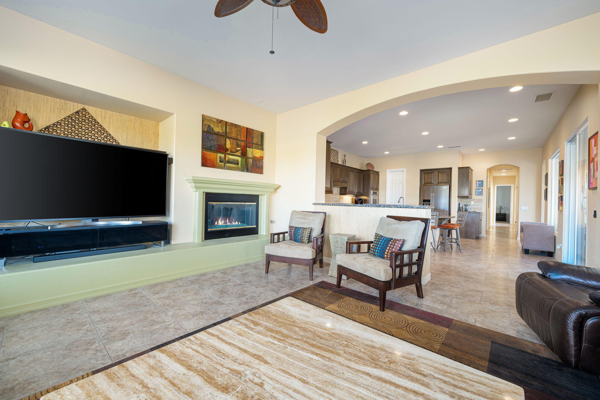 325 Loch Lomond Road Rancho Mirage, CA 92270 - Photo 27 of 49 a living room with furniture a flat screen tv and a fireplace