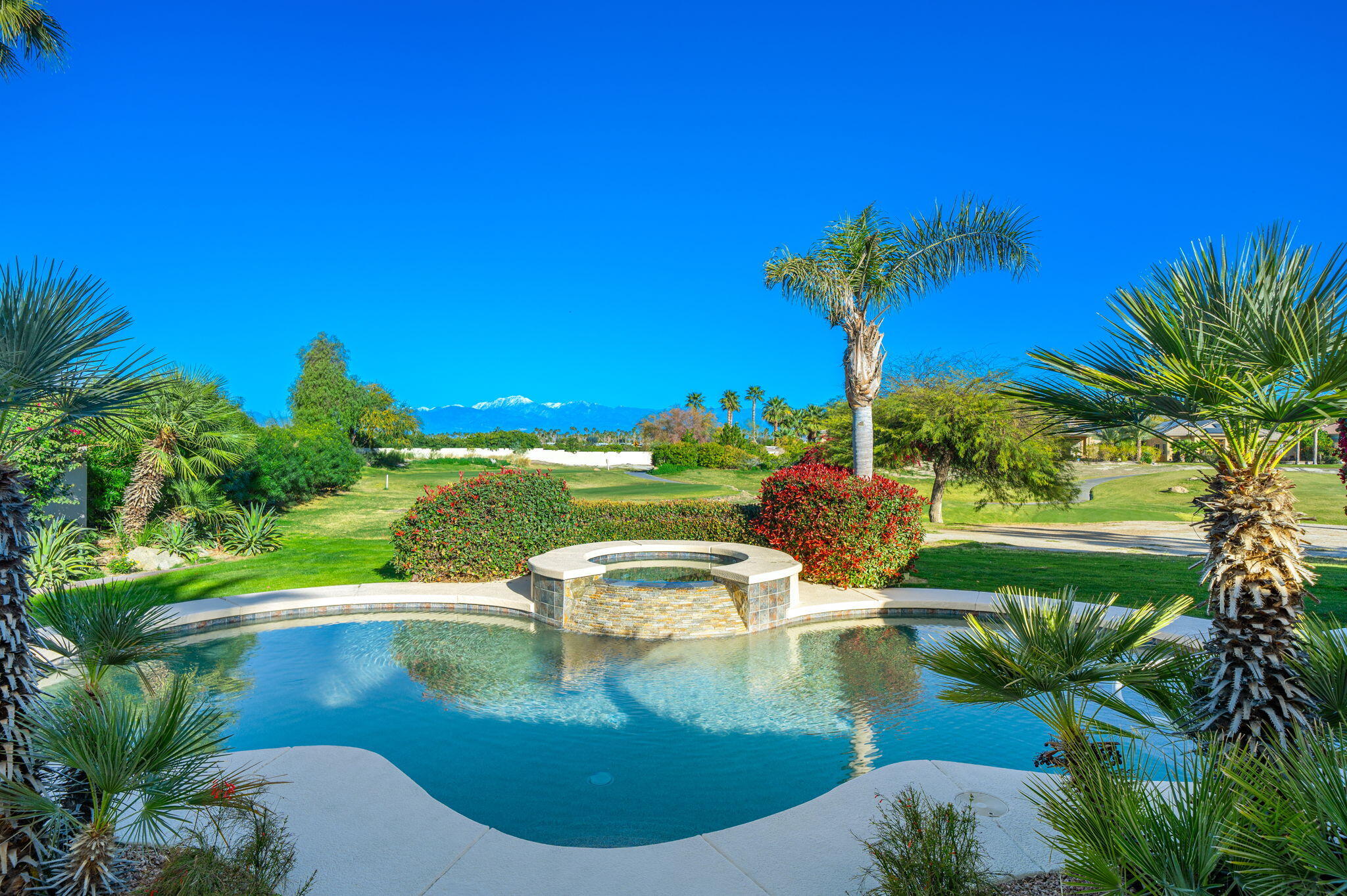 325 Loch Lomond Road Rancho Mirage, CA 92270 - Photo 29 of 49 a view of a swimming pool with a yard