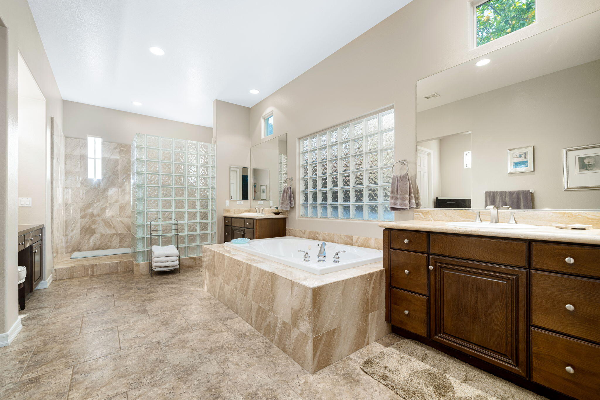 325 Loch Lomond Road Rancho Mirage, CA 92270 - Photo 40 of 49 a large bathroom with a double vanity sink a large mirror and shower