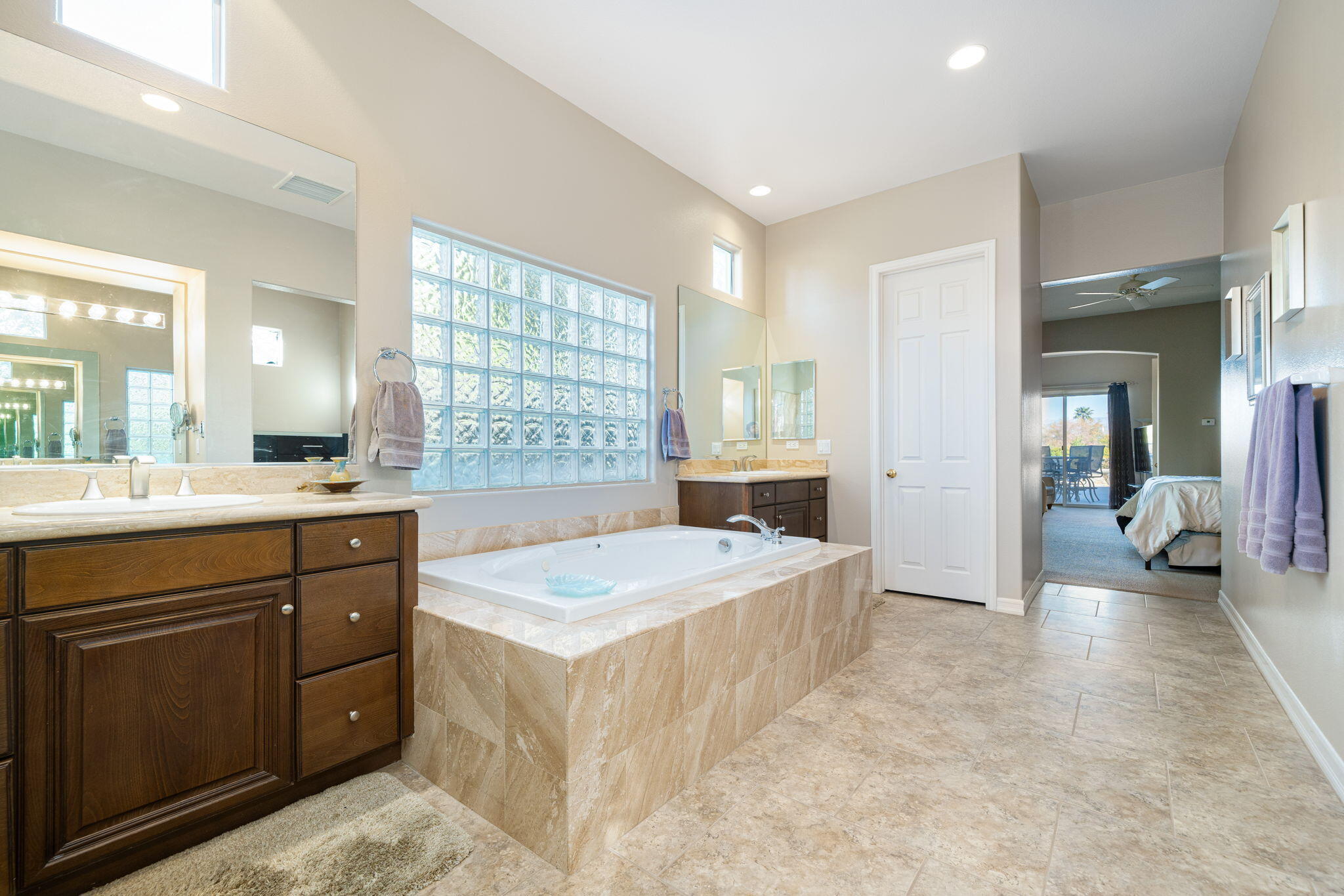 325 Loch Lomond Road Rancho Mirage, CA 92270 - Photo 41 of 49 a spacious bathroom with a tub sink and mirror