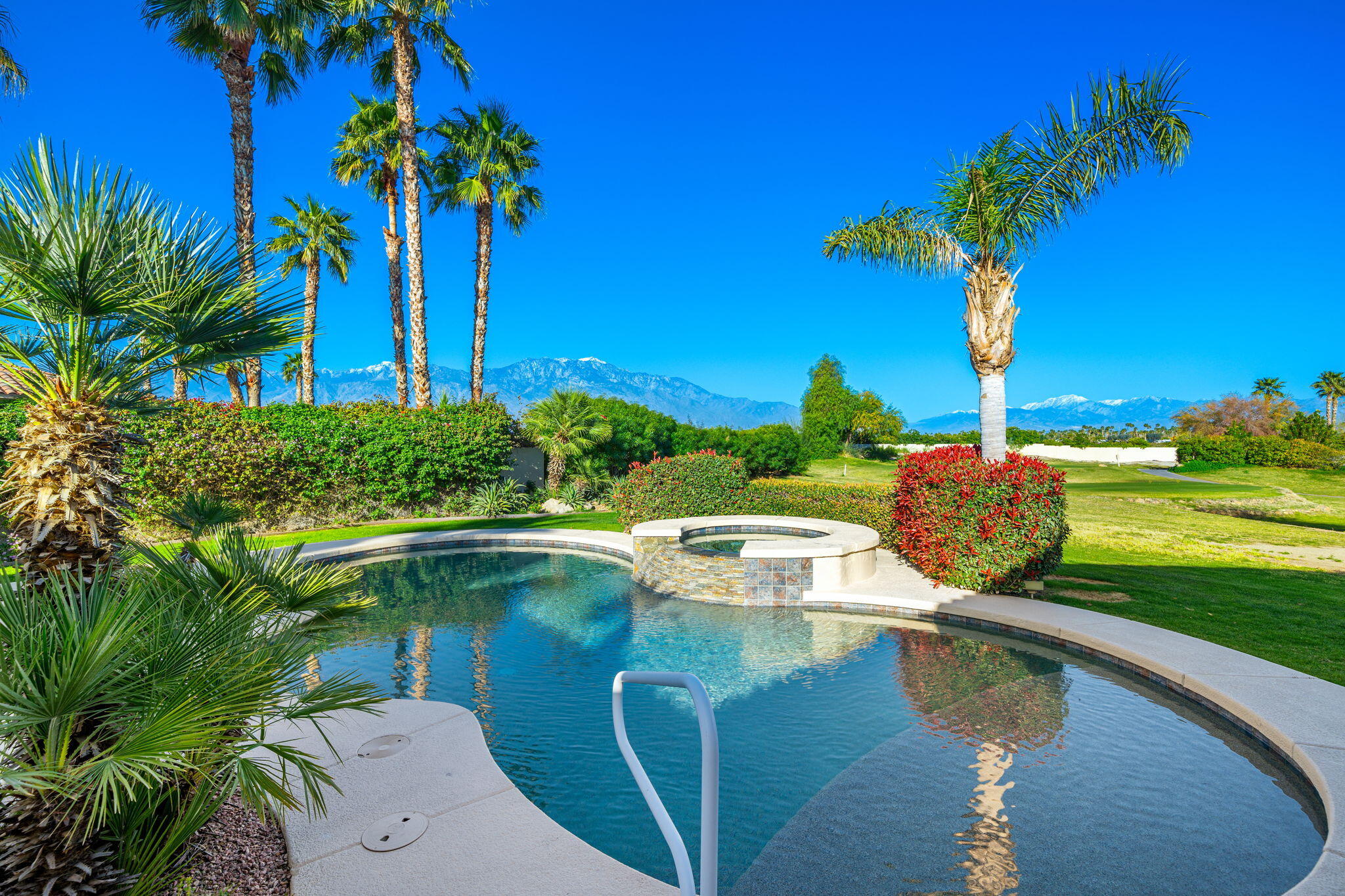 325 Loch Lomond Road Rancho Mirage, CA 92270 - Photo 5 of 49 a view of a garden with a lake view