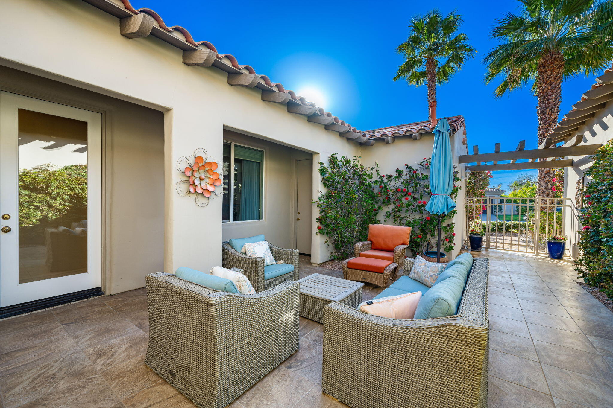325 Loch Lomond Road Rancho Mirage, CA 92270 - Photo 10 of 49 a outdoor living space with furniture and a potted plant
