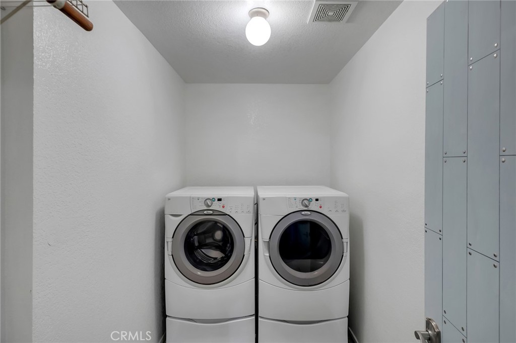 12736 Oasis Road Pinon Hills, CA 92372 - Photo 13 of 33 a utility room with dryer and washer