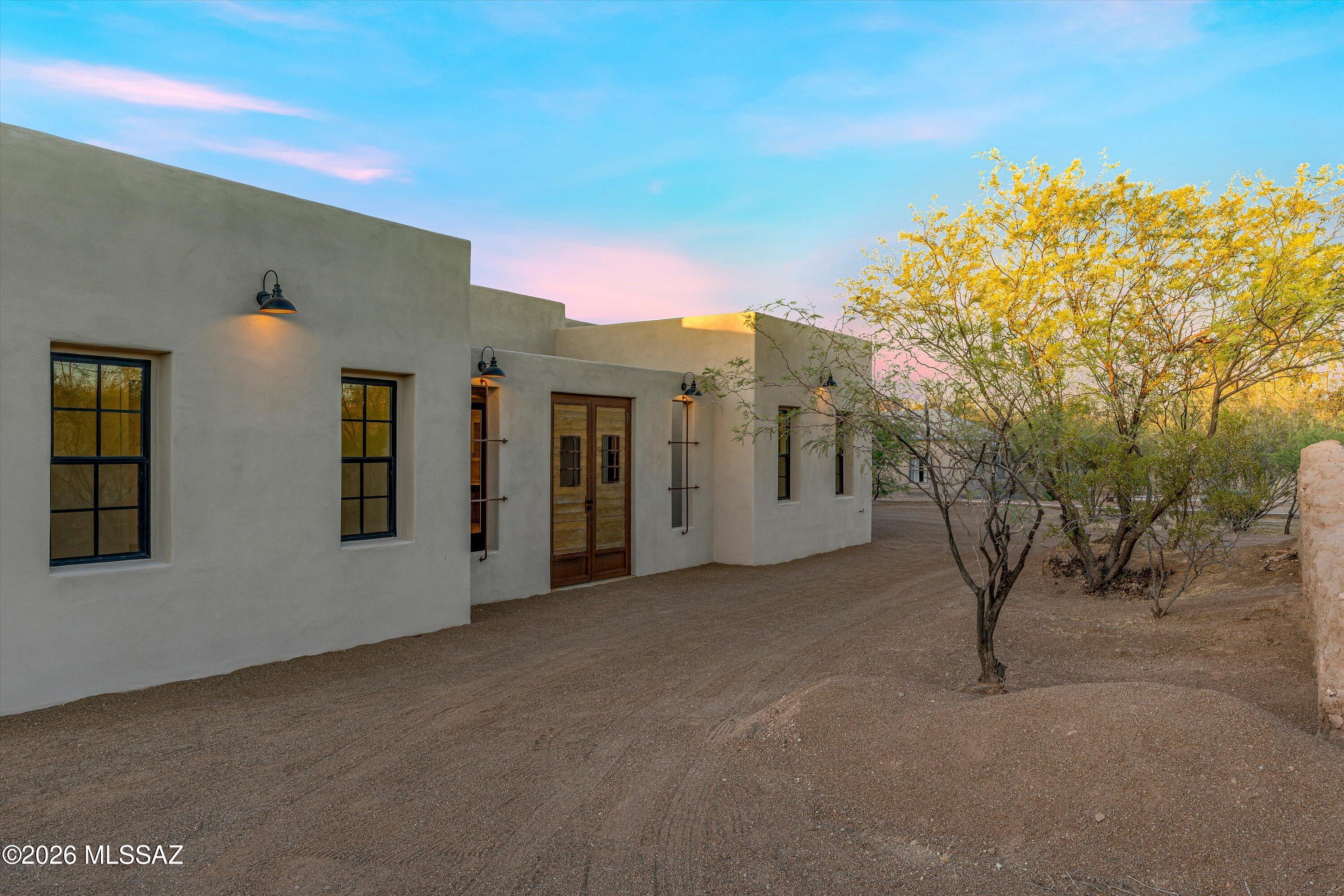 5259 East Fort Lowell Road Tucson, AZ 85712 - Photo 6 of 50 a view of a house with backyard and a tree